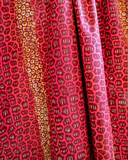 Tissu au yard Stones fushia